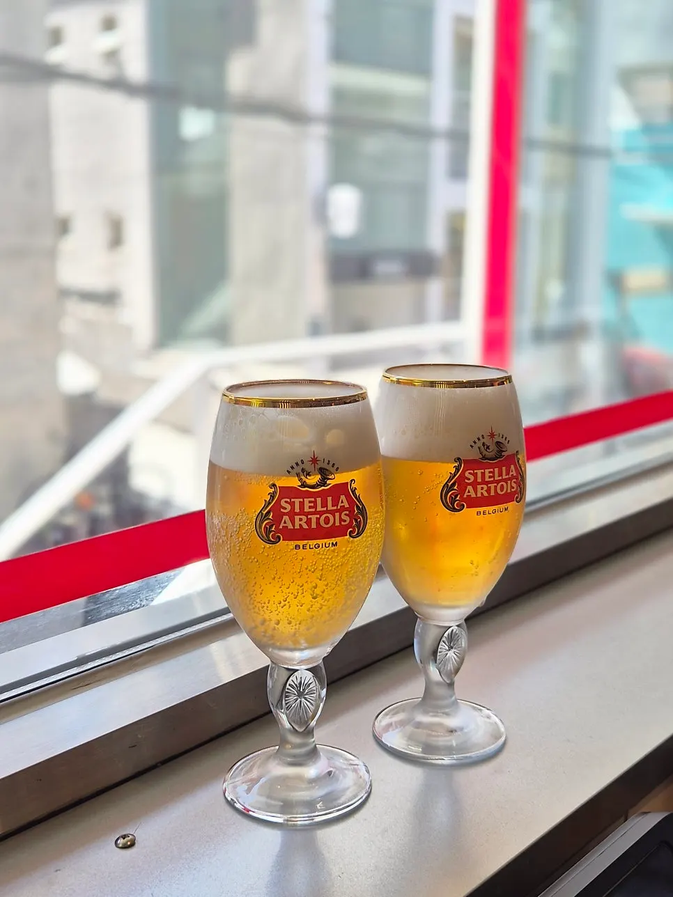 Cold Stella draft beer glass served at the table