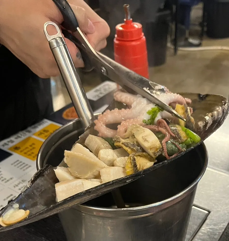 Clam meat and the cool steamed clam broth