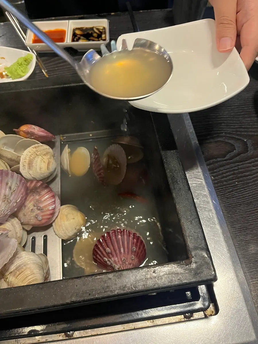 Saero Omija served alongside the steamed clams