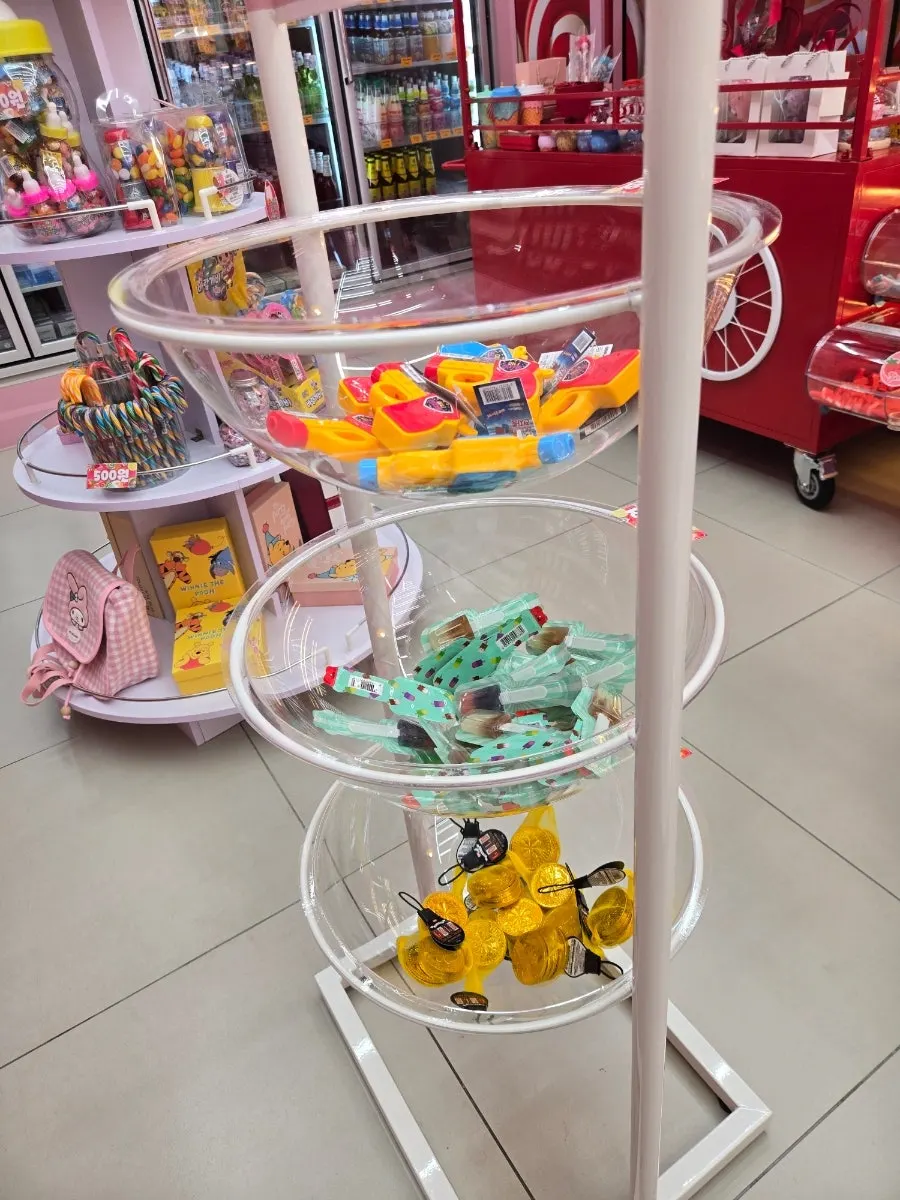 A kid picking out jelly in the shop