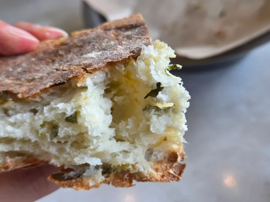 Cross-section of scallion-scented pre-meal bread