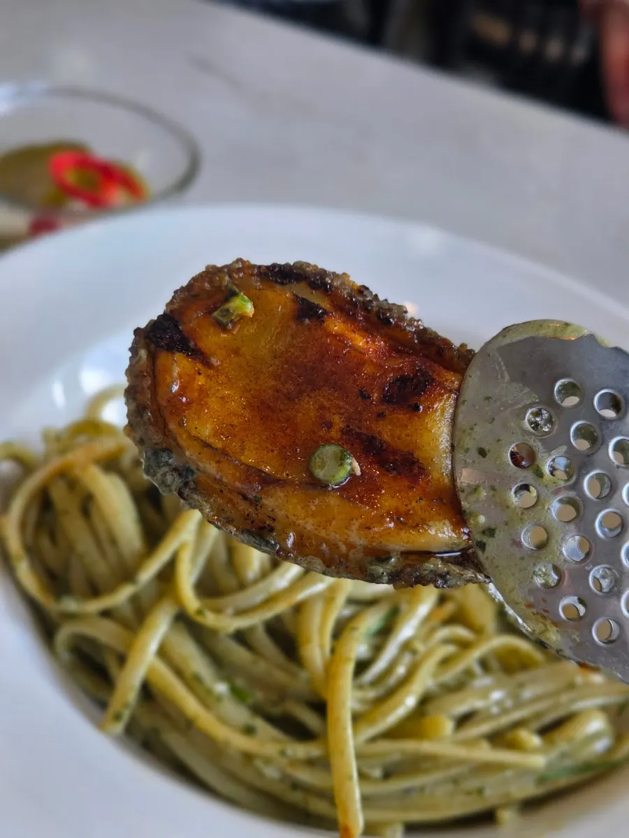 A plate of abalone geou pasta as served