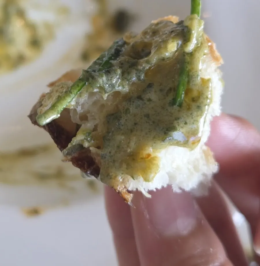 Dipping leftover bread into the remaining geou sauce