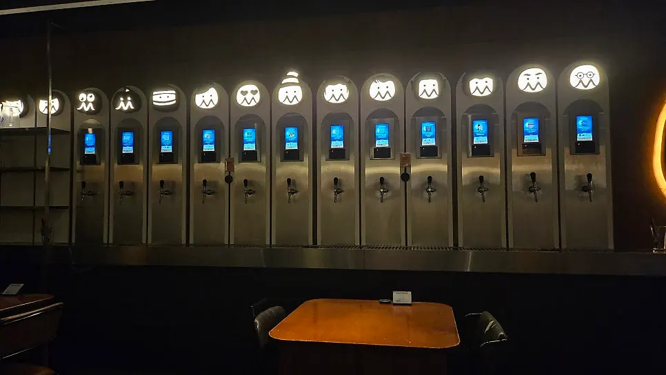 A wall lined with 29 varieties of self-tap craft beer