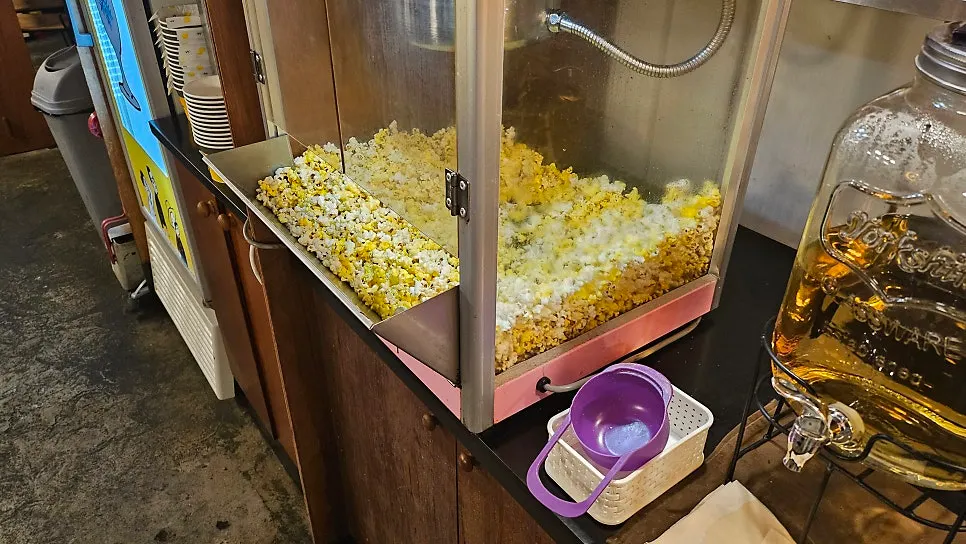 Craft beer and the basic popcorn side dish on the table
