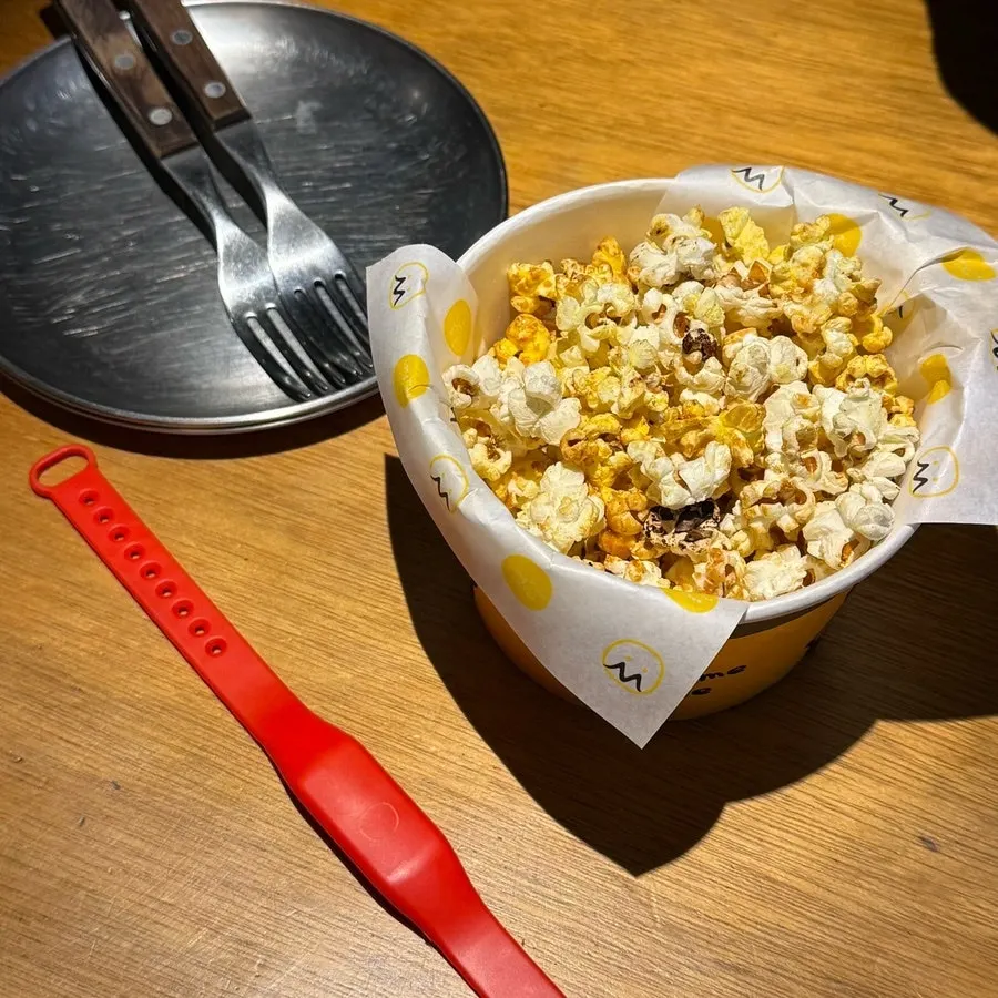 Freshly popped popcorn served as the house snack