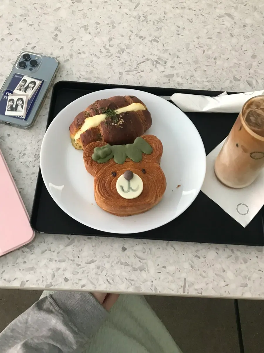 Garlic cream cheese salt bread and coffee on the table