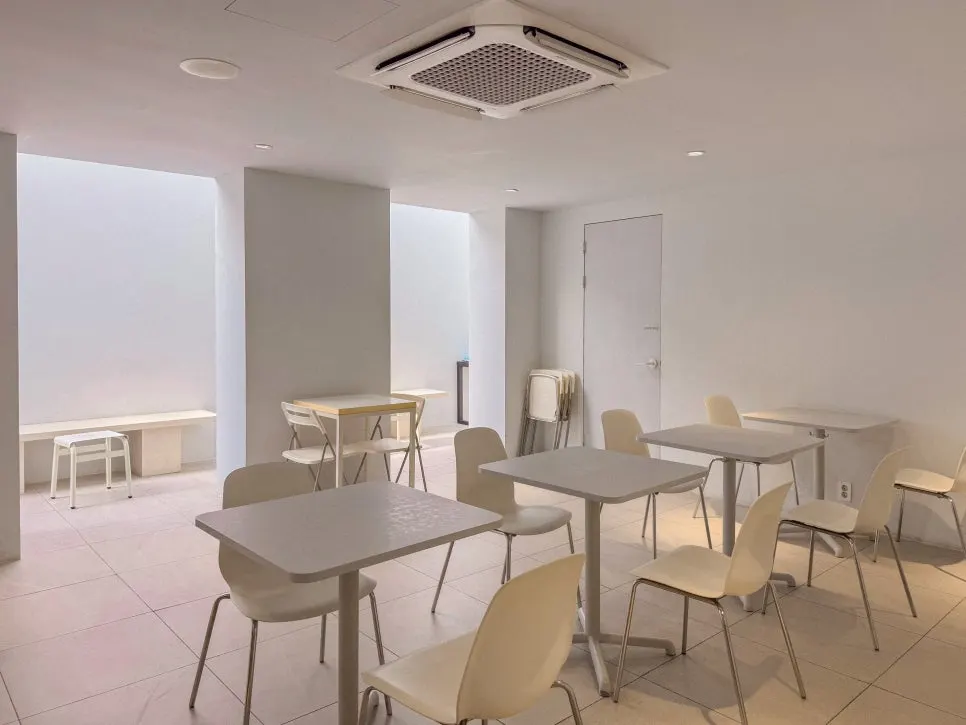 White-toned seating inside LOOOP Bakery