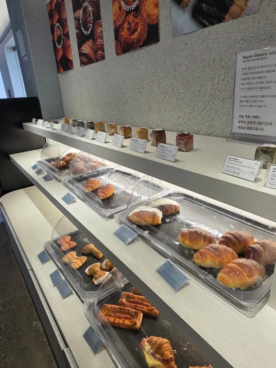 Display case with salt bread, cannelés, and other bakery items