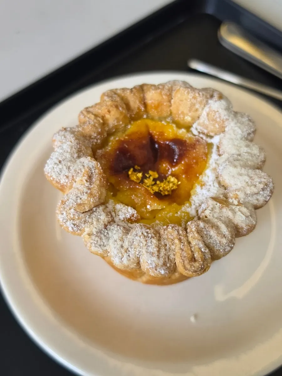 A spread of egg tart and LOOOP Einspänner