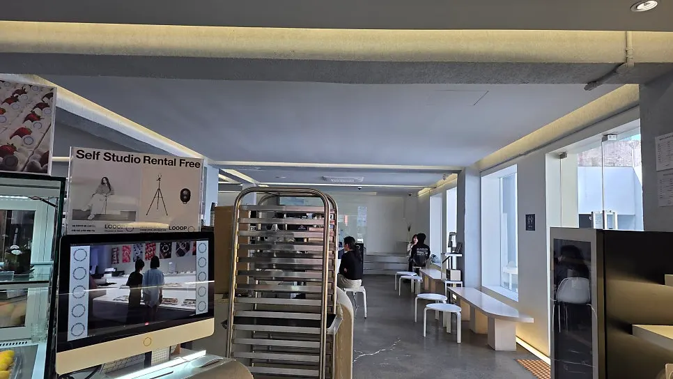 White and gray toned interior of LOOOP Bakery