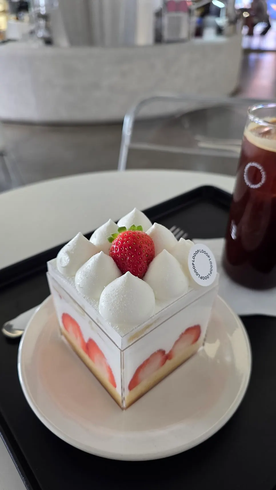 Strawberry cream cake showing strawberry cross-section