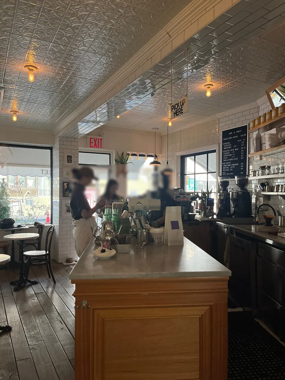 Outdoor space at Low & Sweet Bakery with green plants