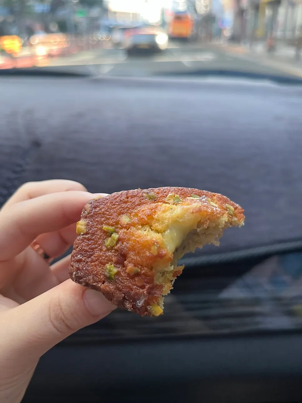 Cross-section of a pistachio madeleine cut in half