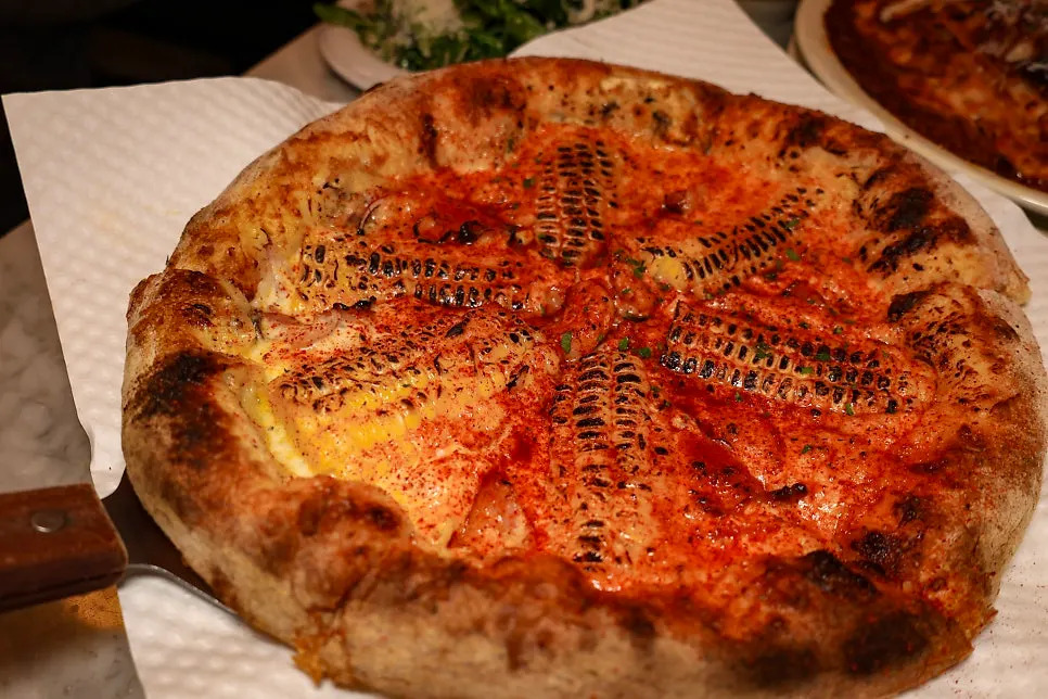 Low Five's corn pizza topped with whole grilled corn