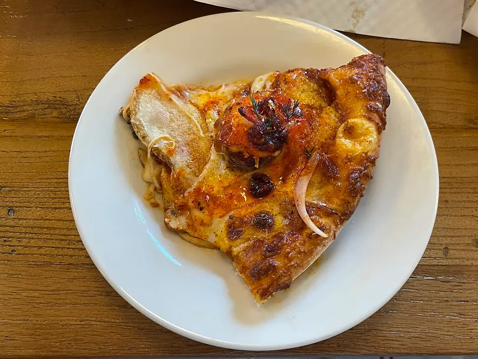 Full view of the half-and-half pizza with both flavors