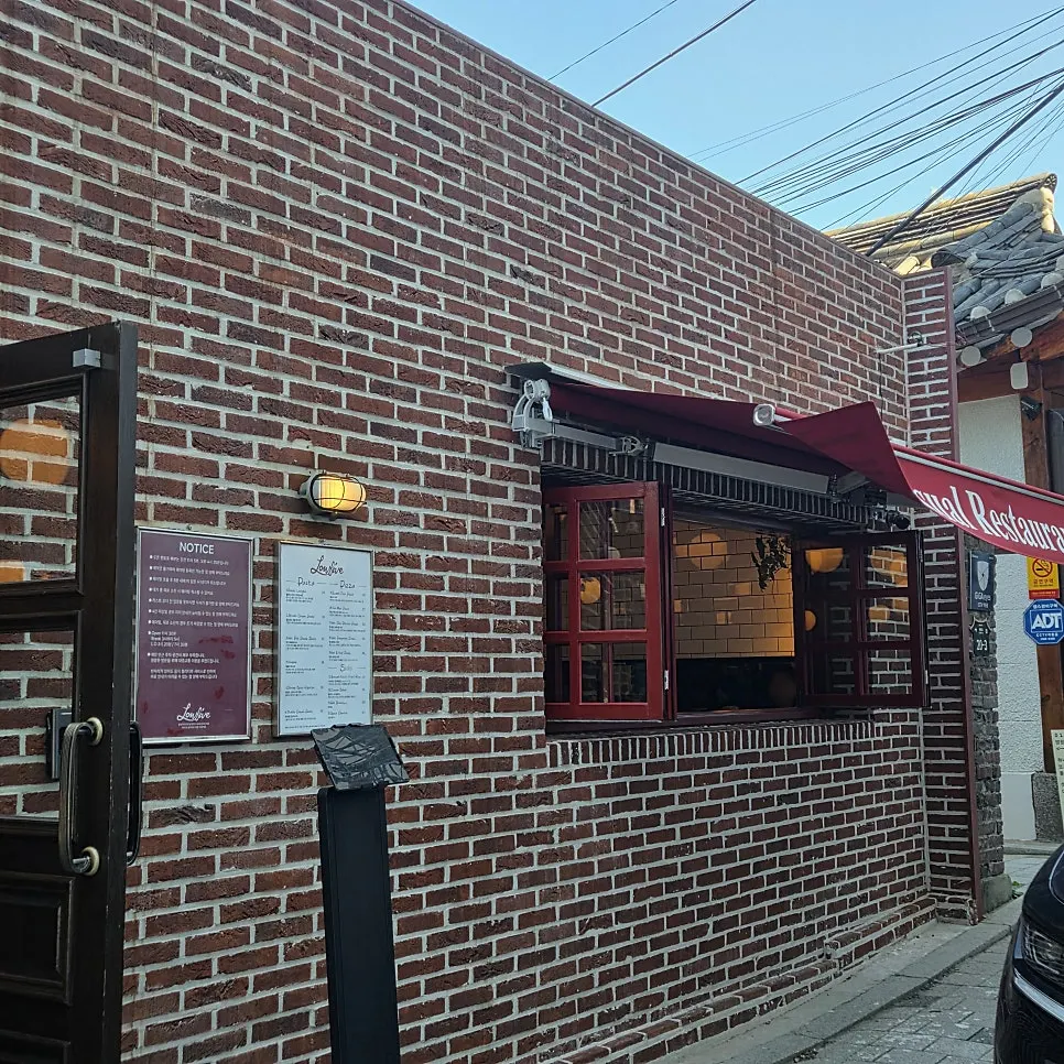 Exterior interior design of Low Five Anguk with an overseas restaurant feel