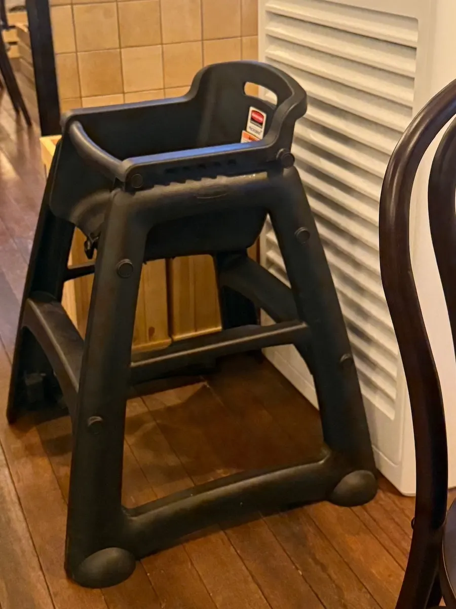 A baby chair set up in the restaurant
