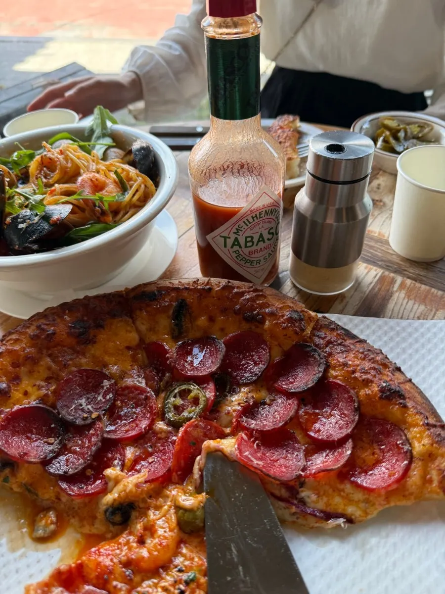 Half-and-half pizza split into two flavors