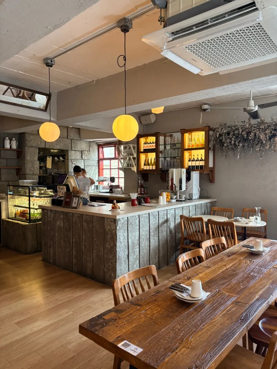 Interior with a large window and neatly set tables