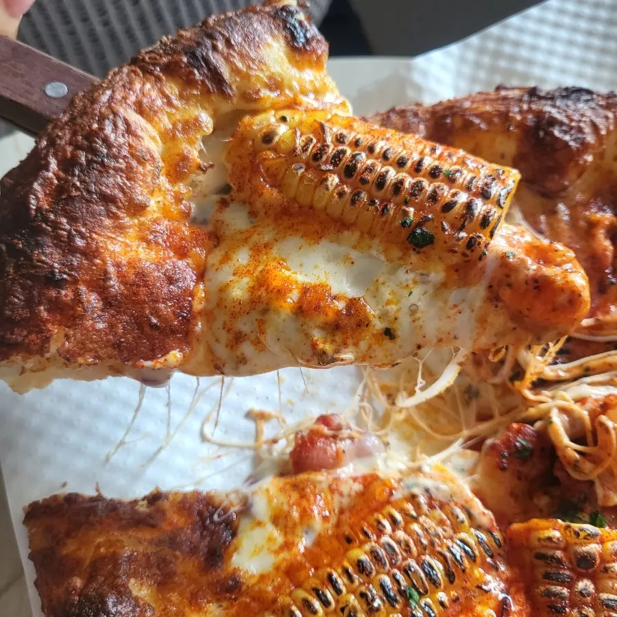 Remaining slices of the corn pizza