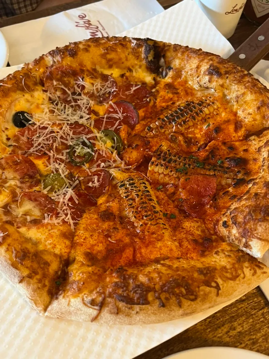 Half-and-half pizza with corn and hot pepperoni