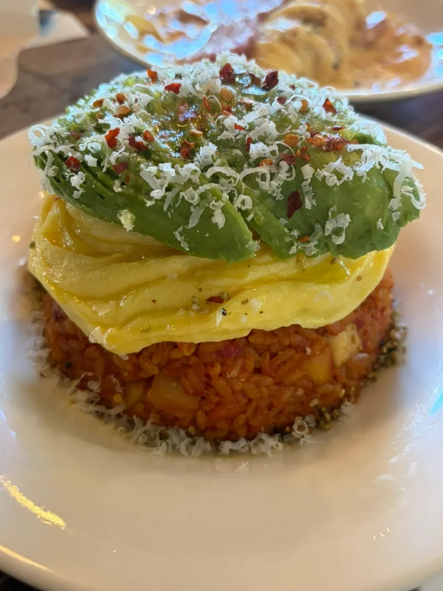 A plate of avocado kimchi fried rice