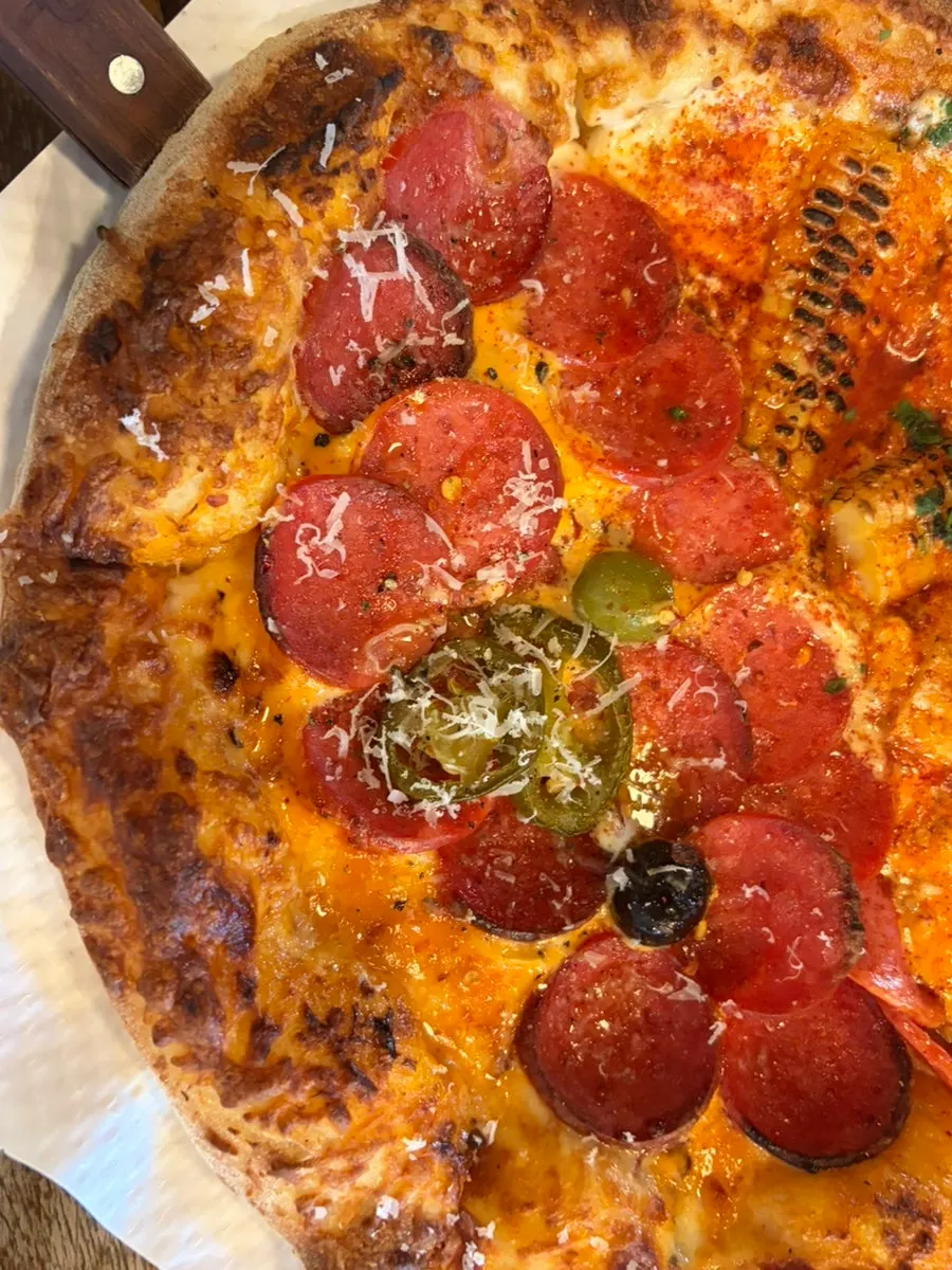 A slice from the half-and-half pizza
