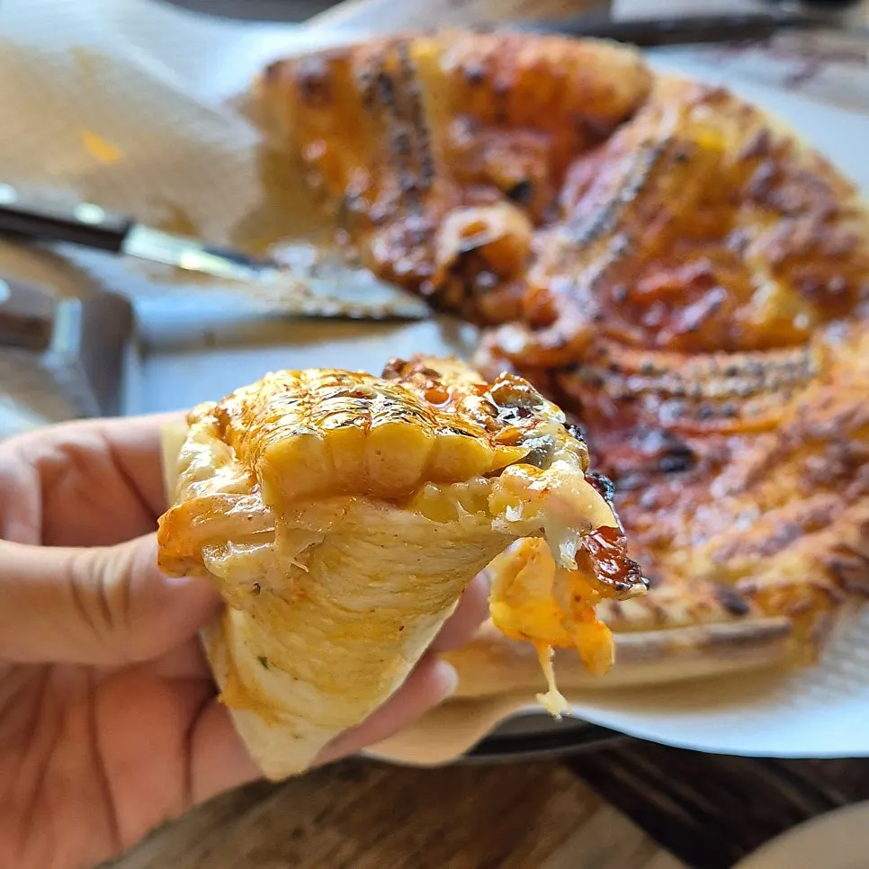 Freshly made corn pizza with steam still rising