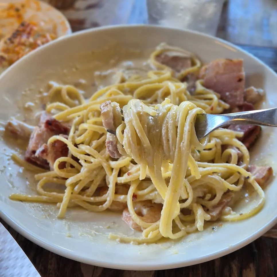 Alfredo cream pasta with plump bacon and cocktail shrimp