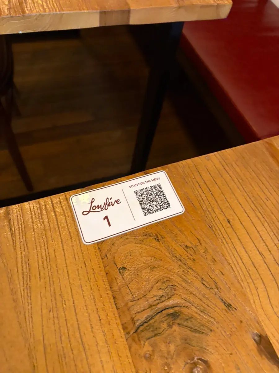 QR code order sign attached to the table