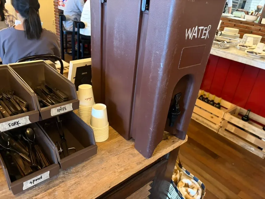 Self-service area with water and wet wipes