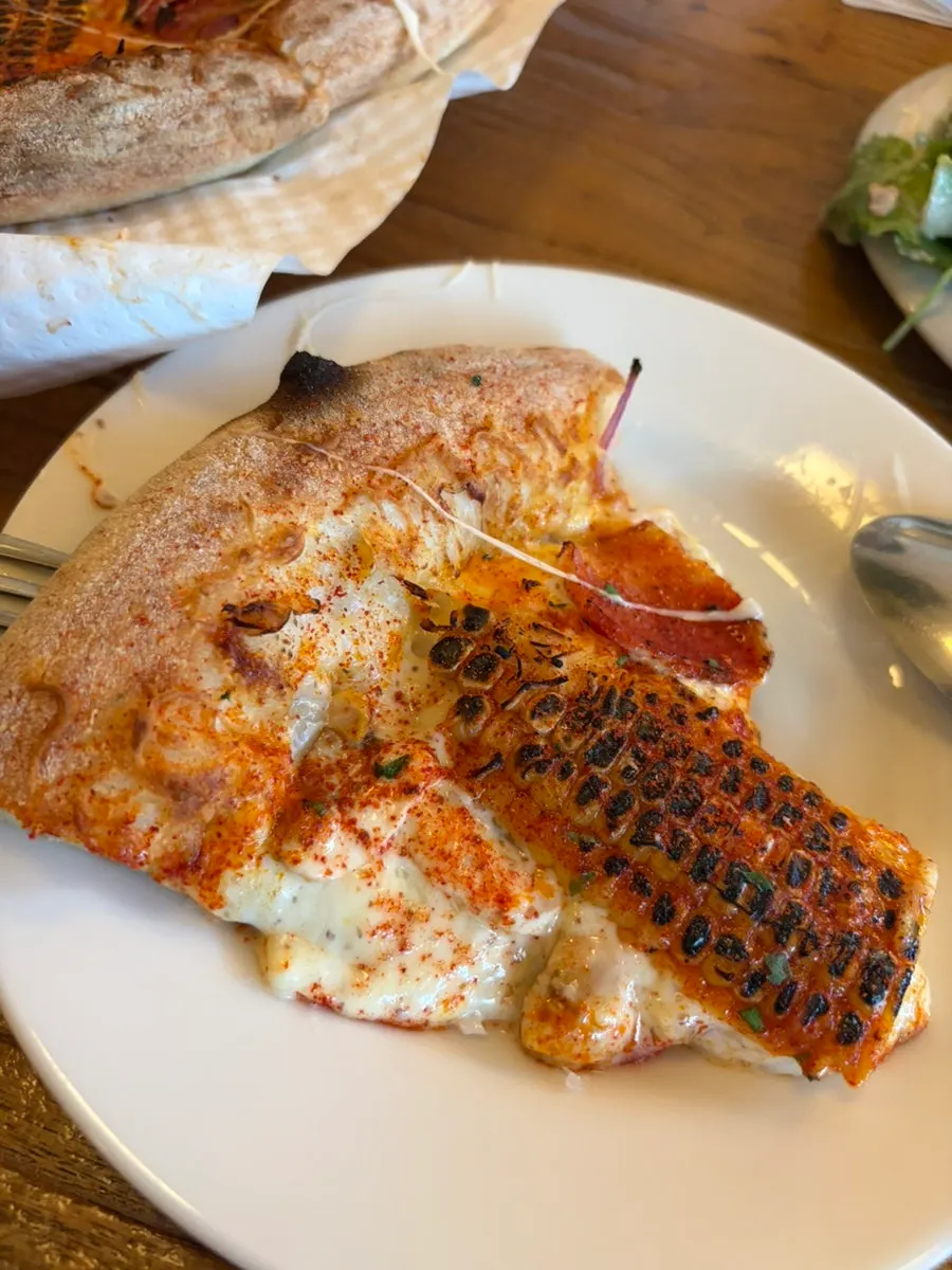 Half-and-half pizza with whole corn and hot pepperoni