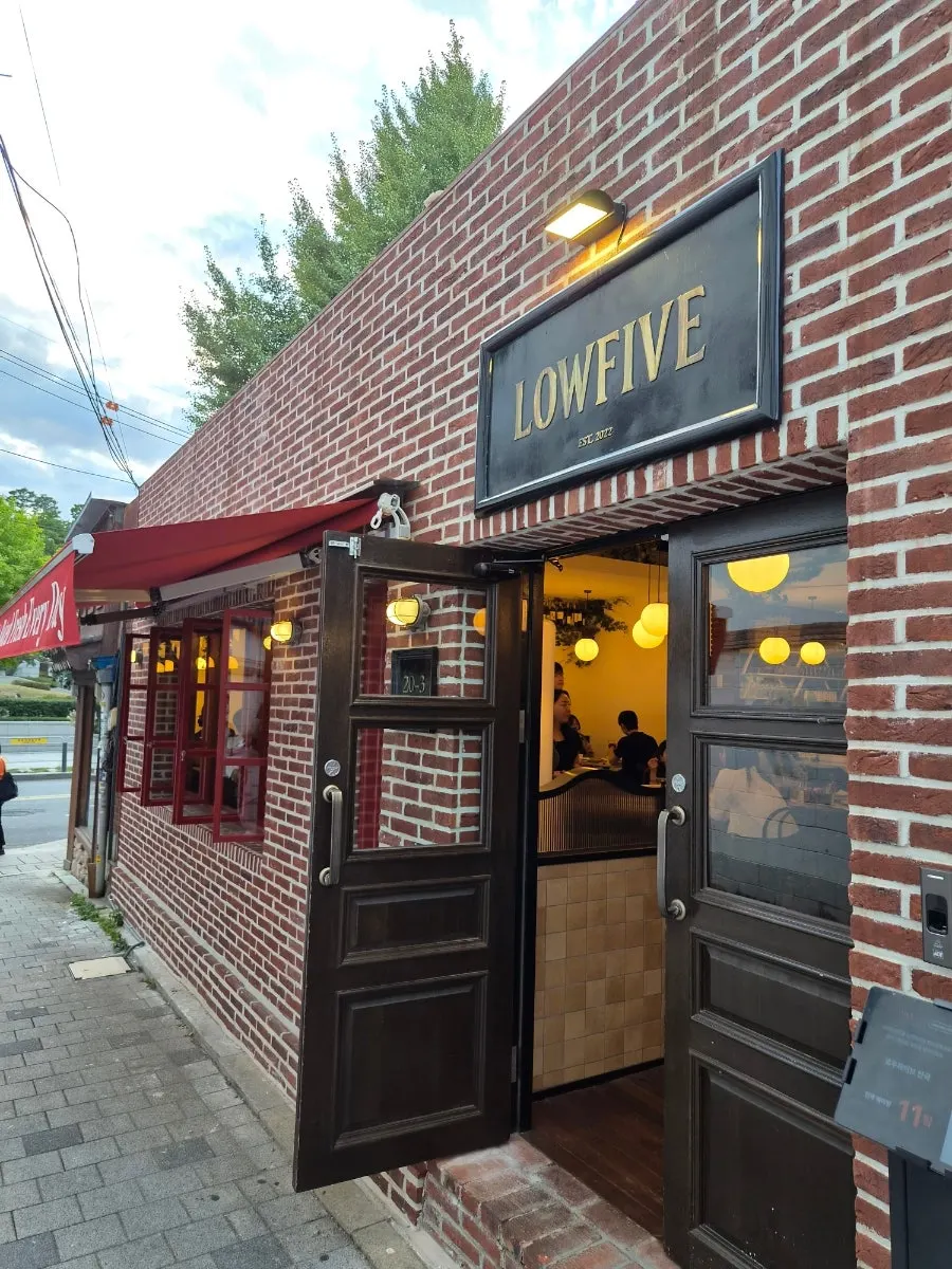 Well-spaced tables and seating at Low Five Anguk