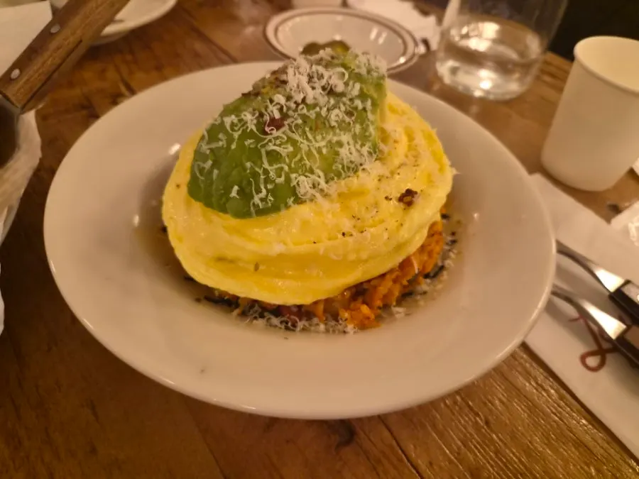 A spoonful of avocado kimchi fried rice