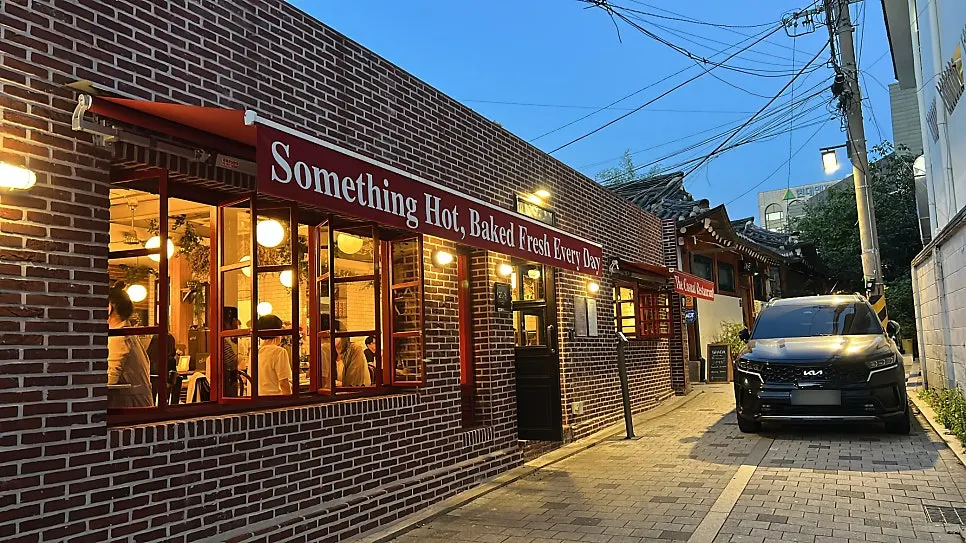 Low Five Anguk storefront with a red brick facade