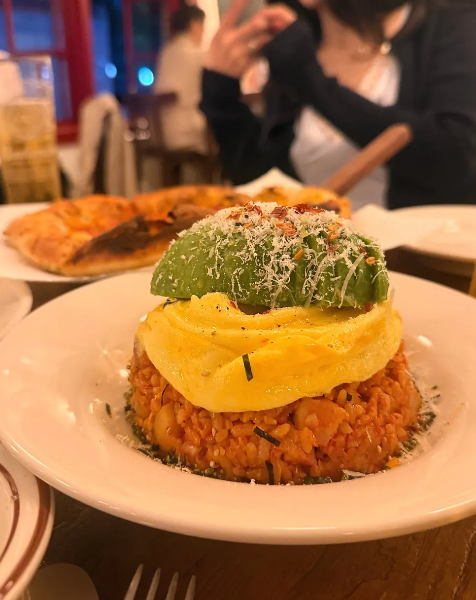 Kimchi fried rice topped with avocado and scrambled egg