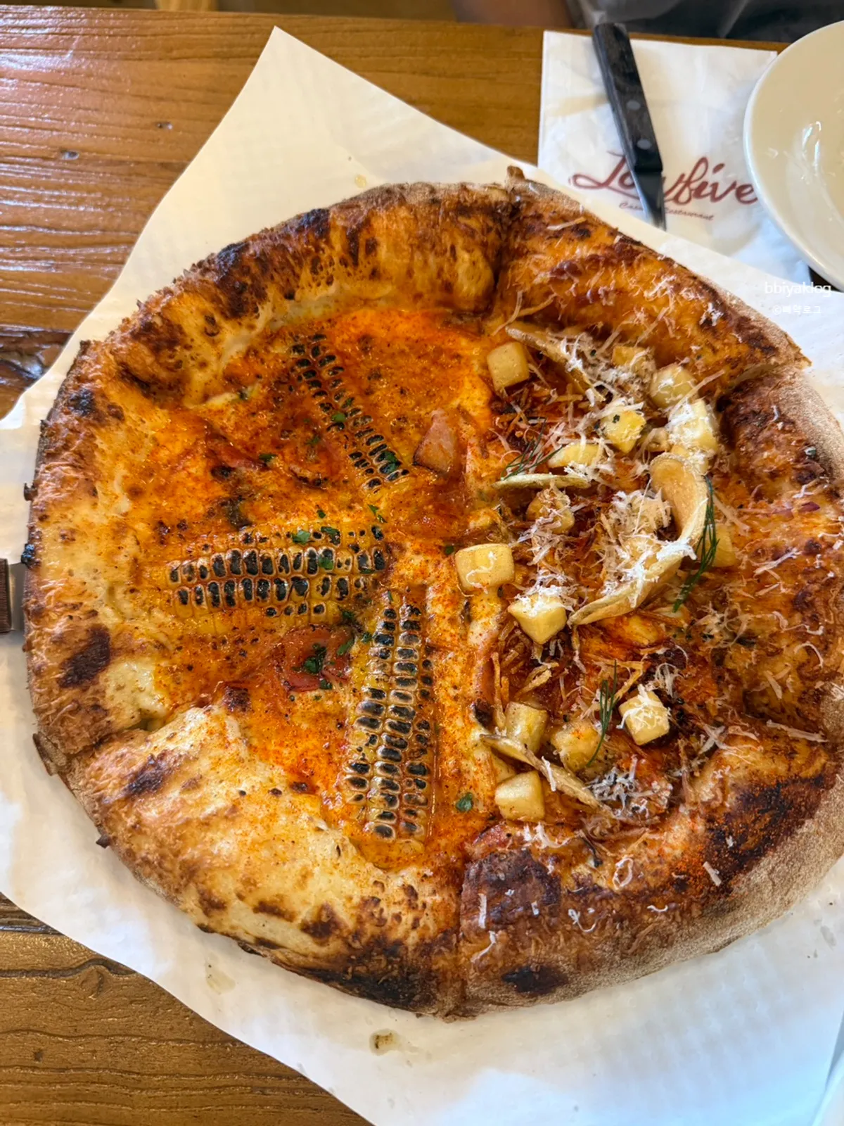 Half and half pizza with corn and potato