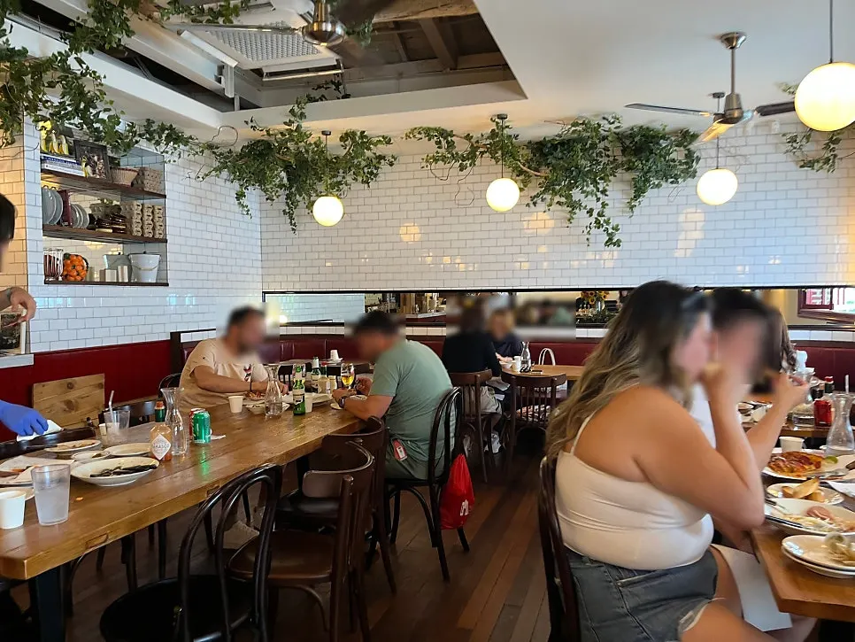 View of the dining hall tables at Low Five Anguk