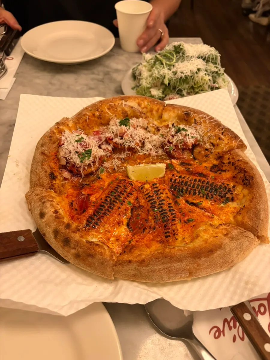 Ordering the half and half pizza at Low Five Anguk