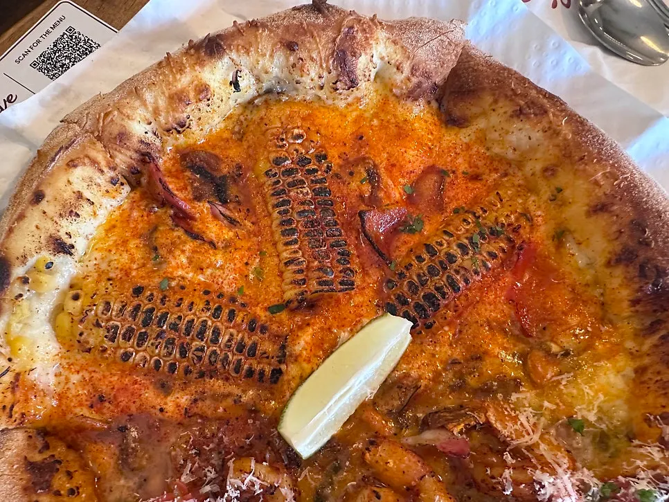 A slice of corn pizza
