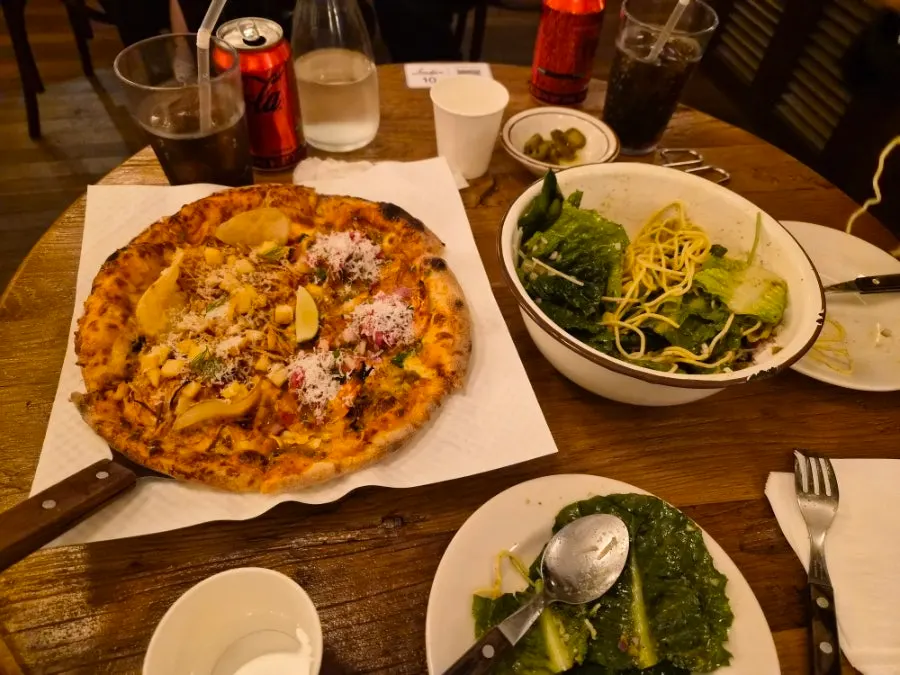 Full shot of the taco and hot chili potato half-and-half pizza