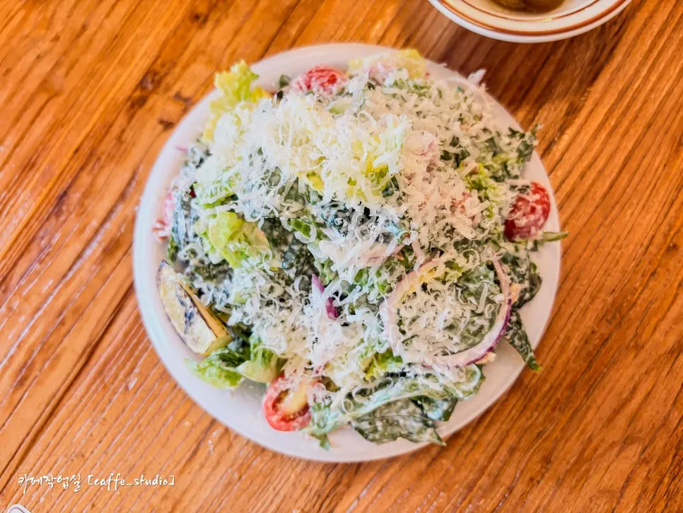 Classic Caesar salad piled high with cheese