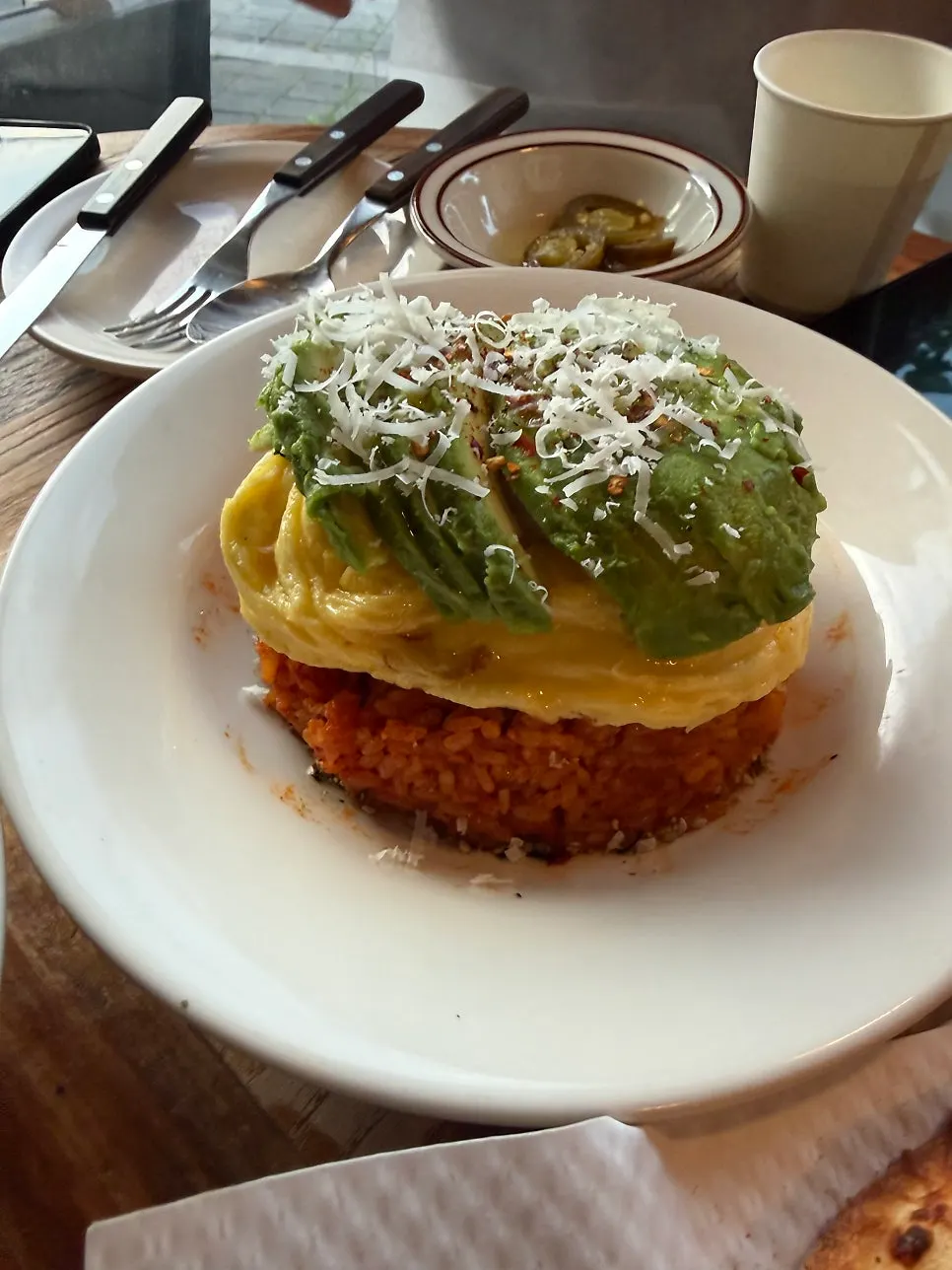 Avocado kimchi fried rice topped with scrambled egg