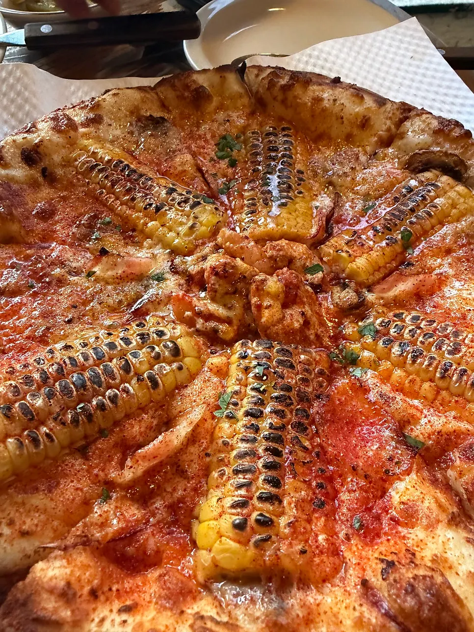 A whole wood-fired corn pizza