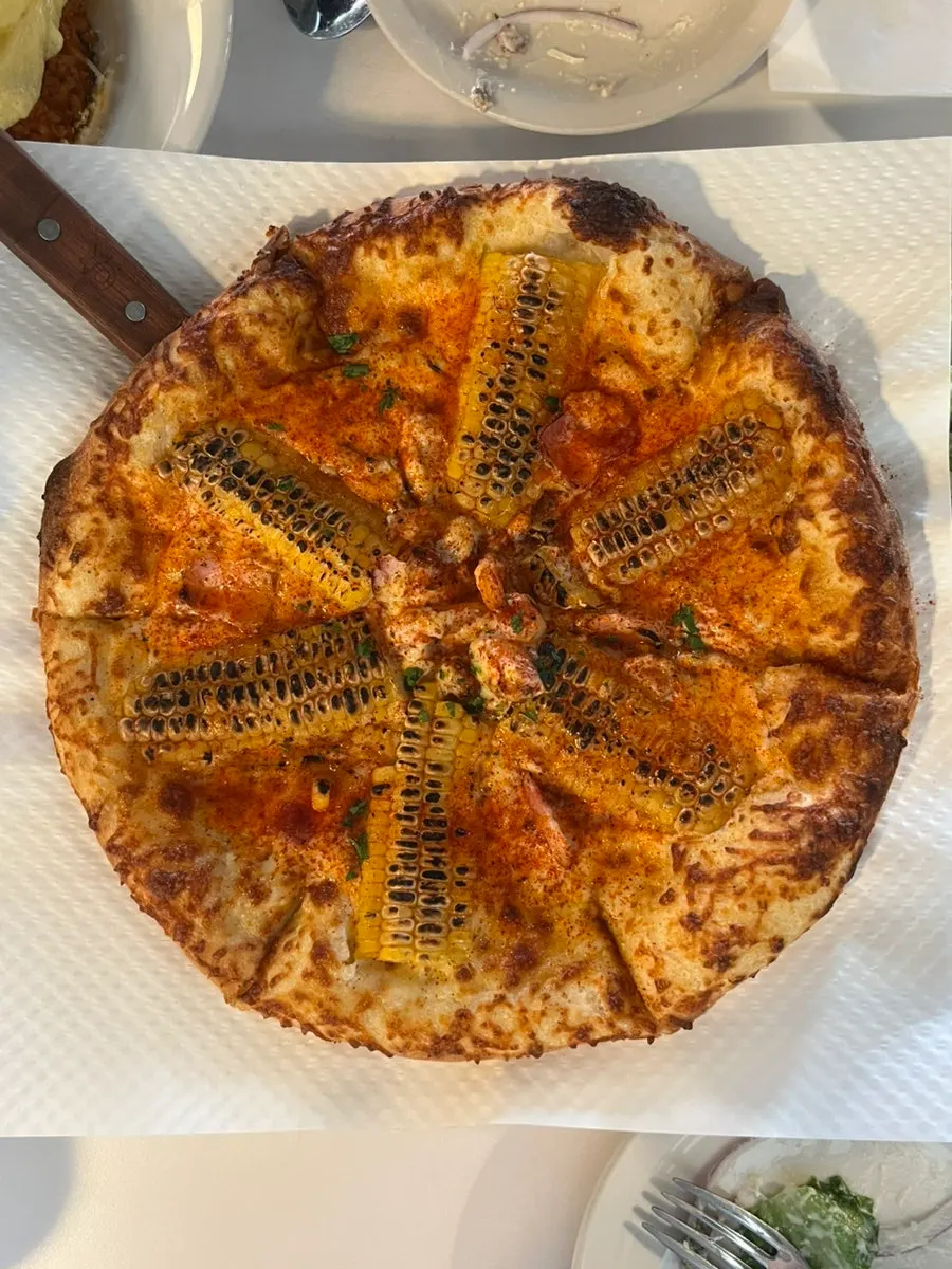 Caesar salad generously topped with cheese