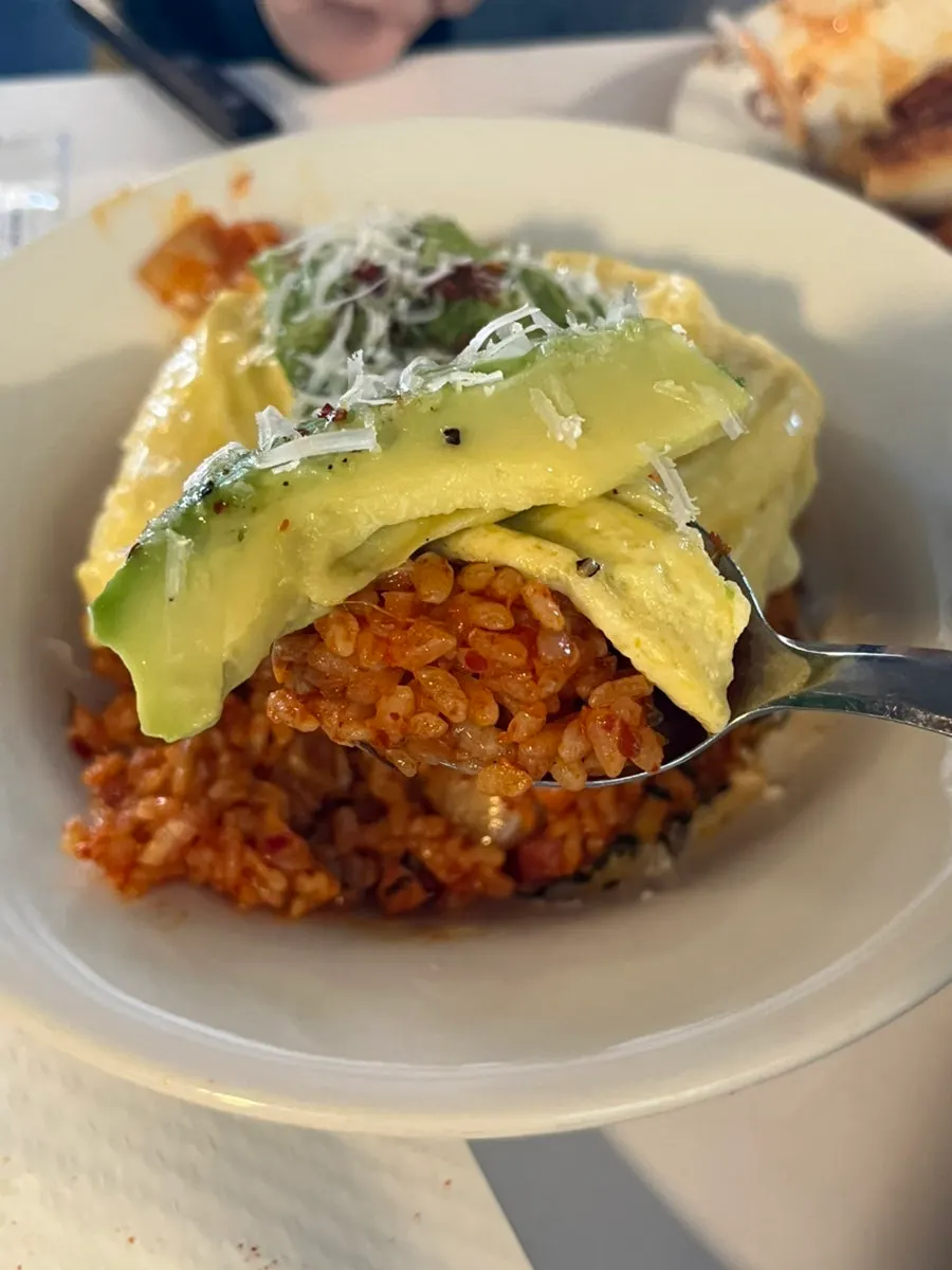 Kimchi fried rice topped with omelette and avocado