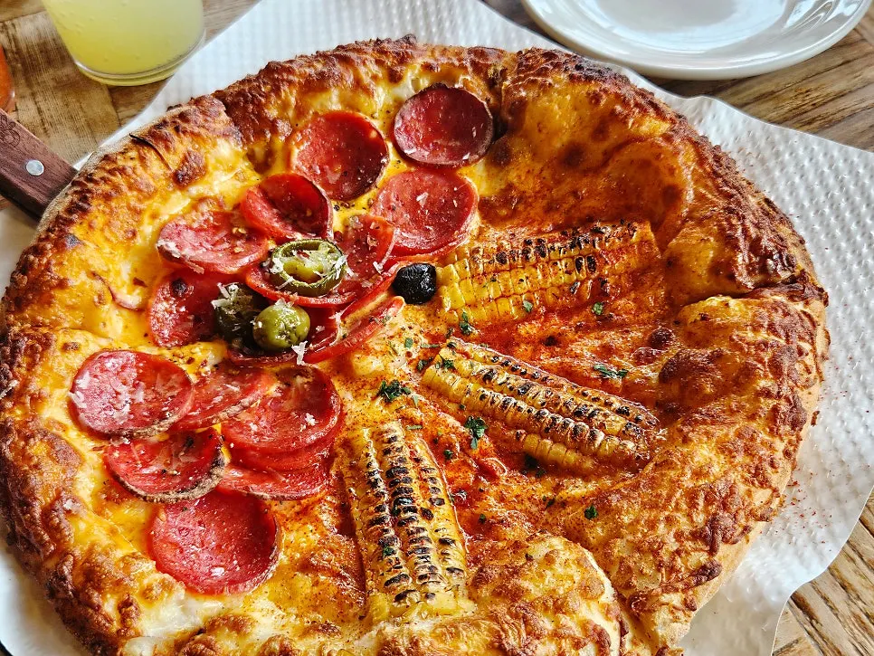Half-and-half pizza and lasagna set on the table