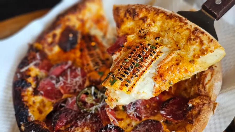 Half-and-half pizza with deeply charred crust