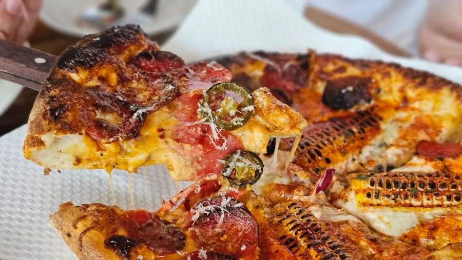 Cross-section of the red-sauced hot pepperoni pizza